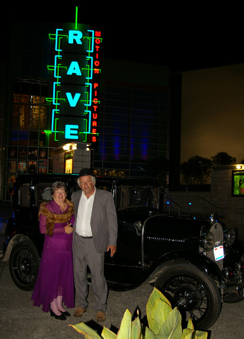 Couple drive their vintge car to premiere
